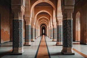 Long hallway with patterned columns and arches in a historic building. photo