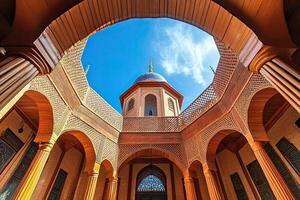 Low angle view of a mosque courtyard with intricate wooden architecture and a blue sky visible through the open dome. photo