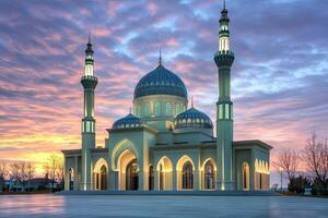 Majestic mosque at sunset, illuminated, showcasing intricate architecture and vibrant sky. photo