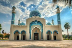 Majestic blue-domed mosque under a vibrant sky. photo