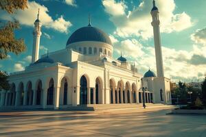 Majestic white mosque under a vibrant sky. photo