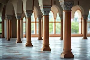 Ornate columns in a grand hall with arched windows and tiled floor. photo