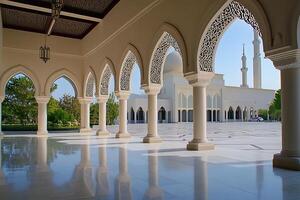 Mosque courtyard with arched colonnade and gleaming marble floor. photo