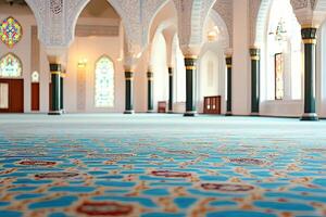 Ornate mosque interior with carpet, arches, and stained glass windows. photo