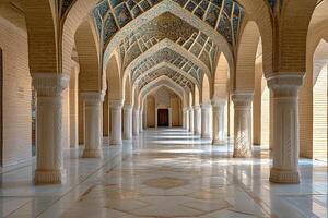 Sunlit arcade with ornate columns, arches, and mosaic ceiling. photo