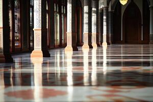 Sunlit corridor with ornate columns and marble floor. photo