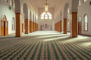 Sunlit interior of a mosque with arched windows, wooden columns, and patterned carpet. photo