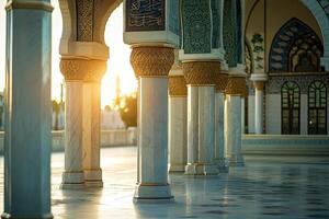 Sunlit mosque courtyard with ornate columns and arches. photo