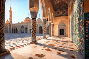 Sunlit mosque courtyard with ornate columns and tilework. photo