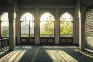 Sunlit mosque interior with arched windows showing city view. photo