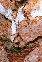 an old broken brick wall in an old castle. broken vaults photo
