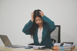 Stressed female worker and business woman holding a pile of paperwork while getting more work to do. Looking frustrated in camera, isolated on white background. Concept Too much work photo