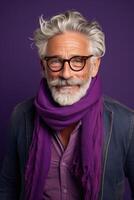 60 year old fashionable hipster man portrait on bright purple background photo