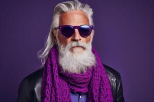 60 year old fashionable hipster man portrait on bright purple background photo
