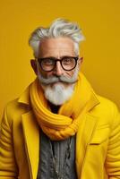 60 year old fashionable hipster man portrait on bright yellow background photo