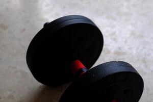 A versatile, adjustable weight barbell ideal for strength training and fitness routines at home or in gyms. photo