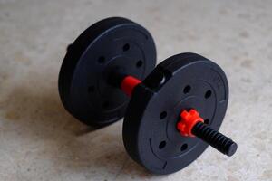 A versatile, adjustable weight barbell ideal for strength training and fitness routines at home or in gyms. photo