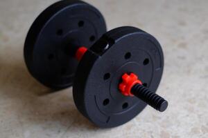A versatile, adjustable weight barbell ideal for strength training and fitness routines at home or in gyms. photo