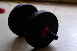 A versatile, adjustable weight barbell ideal for strength training and fitness routines at home or in gyms. photo