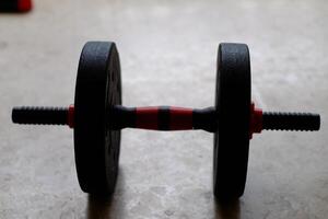 A versatile, adjustable weight barbell ideal for strength training and fitness routines at home or in gyms. photo