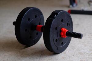 A versatile, adjustable weight barbell ideal for strength training and fitness routines at home or in gyms. photo