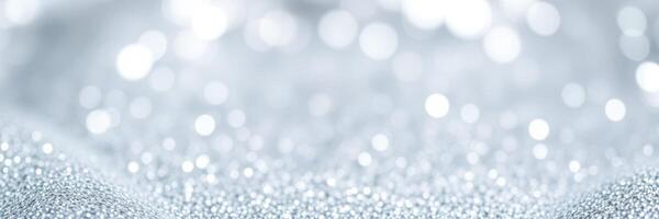 Sparkling silver texture with soft bokeh effect creates an elegant backdrop for various design and decoration projects photo
