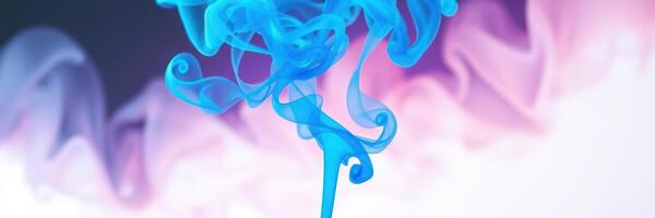 Colorful blue smoke swirls gracefully against a background of soft pink and white hues photo