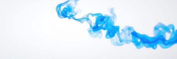 Colorful blue smoke swirling gracefully against a white background photo