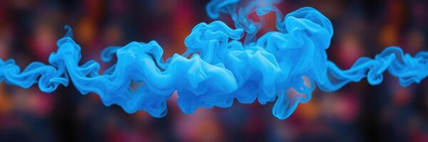 Blue smoke swirling in vibrant colors of a dark background during a creative performance at night photo