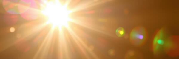 Bright sunlight beams through a clear sky, creating a vibrant glow and illuminating the surroundings in the early morning hours photo
