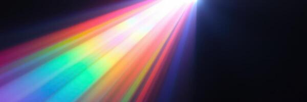 Colorful light beam illuminating darkness while creating a vibrant display of rainbow hues photo