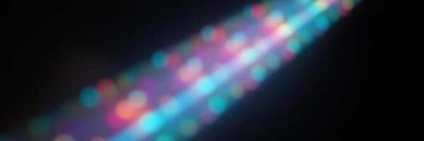 Colorful light streaks create a mesmerizing effect in a dark environment during a nighttime event photo