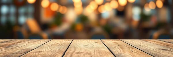 Wooden table in a warmly lit cafe atmosphere during evening hours with blurred background and soft bokeh lights photo