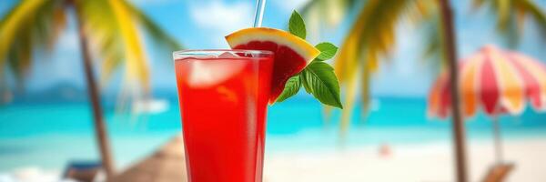 Refreshing tropical drink on a beach with palm trees and sunny skies in the background photo