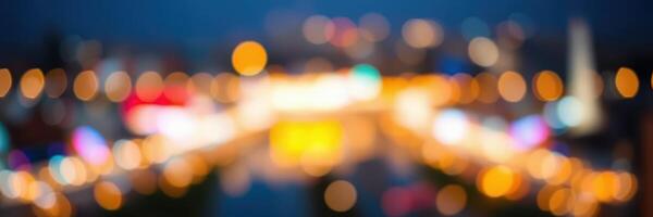 City lights illuminate a vibrant skyline during nighttime with a blurred background effect photo