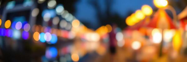 Colorful lights illuminate a bustling market during the evening hours, creating a vibrant atmosphere for visitors photo