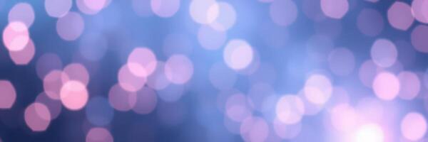Colorful bokeh lights create a dreamy atmosphere in a night setting with soft blue and pink hues photo