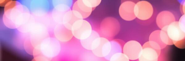 Colorful bokeh lights create a festive atmosphere in a vibrant setting during a lively celebration photo