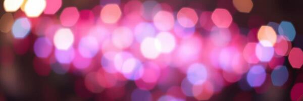 Colorful bokeh lights create a festive atmosphere during a night celebration in the city photo