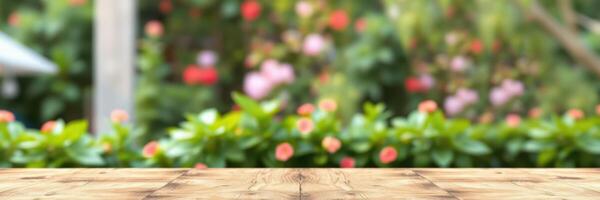 Outdoor wooden table with blurred flower garden background on sunny day photo