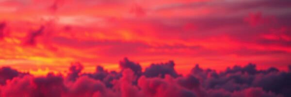 Vibrant sunset illuminates the sky with shades of orange and pink over a serene horizon photo