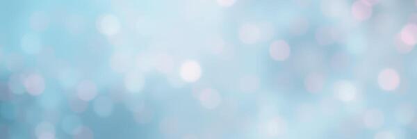 Soft blue bokeh background creates a dreamy atmosphere for artistic projects and designs photo