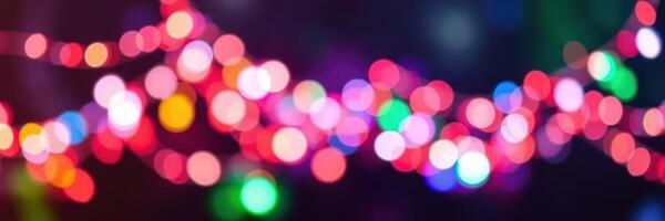 Colorful bokeh lights create a festive atmosphere during evening celebrations in a lively outdoor setting photo