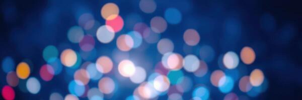 Colorful bokeh lights create a festive atmosphere during a nighttime celebration in a vibrant city setting photo