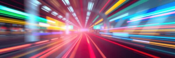 Vibrant light trails create dynamic motion in a blurred urban tunnel during nighttime photo