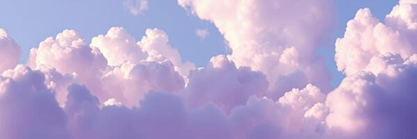 Beautiful fluffy clouds scattered across a bright sky during late afternoon photo