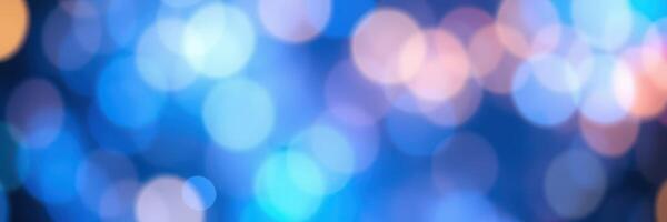 Bright abstract blue bokeh background with soft colorful orbs for artistic effects and design projects photo