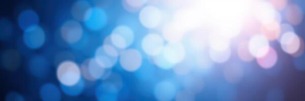 Soft blue and white bokeh lights create a dreamy atmosphere at a nighttime event or celebration photo
