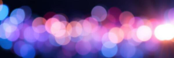 Colorful bokeh lights create a vibrant atmosphere at an evening event during late summer nights photo