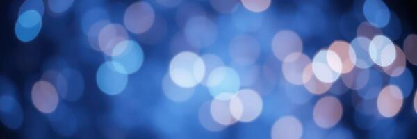 Soft blue bokeh lights create a dreamy atmosphere in an abstract background during a nighttime event photo